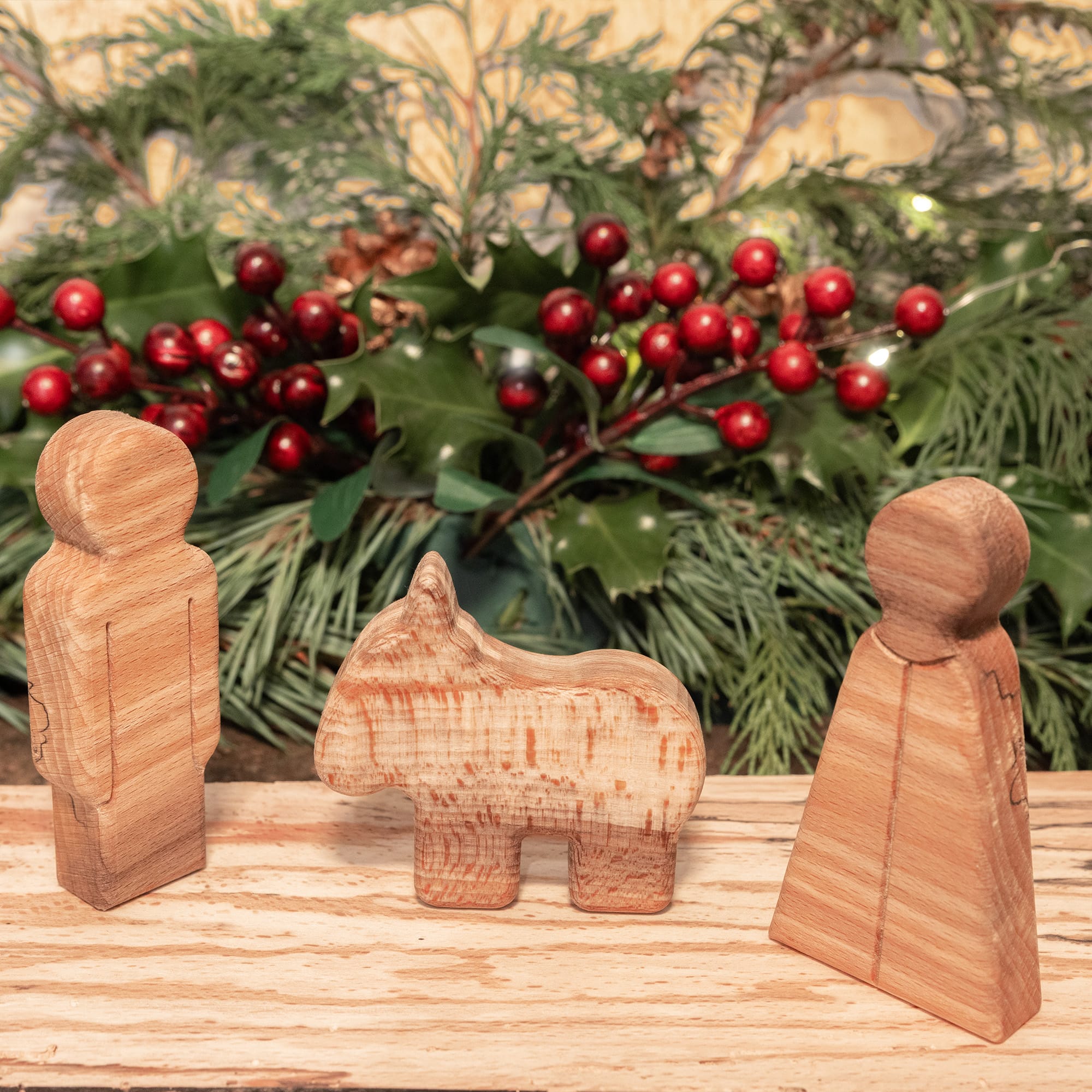 Close-up of the wooden Mary, Joseph and donkey figures showing the spalted beech grain