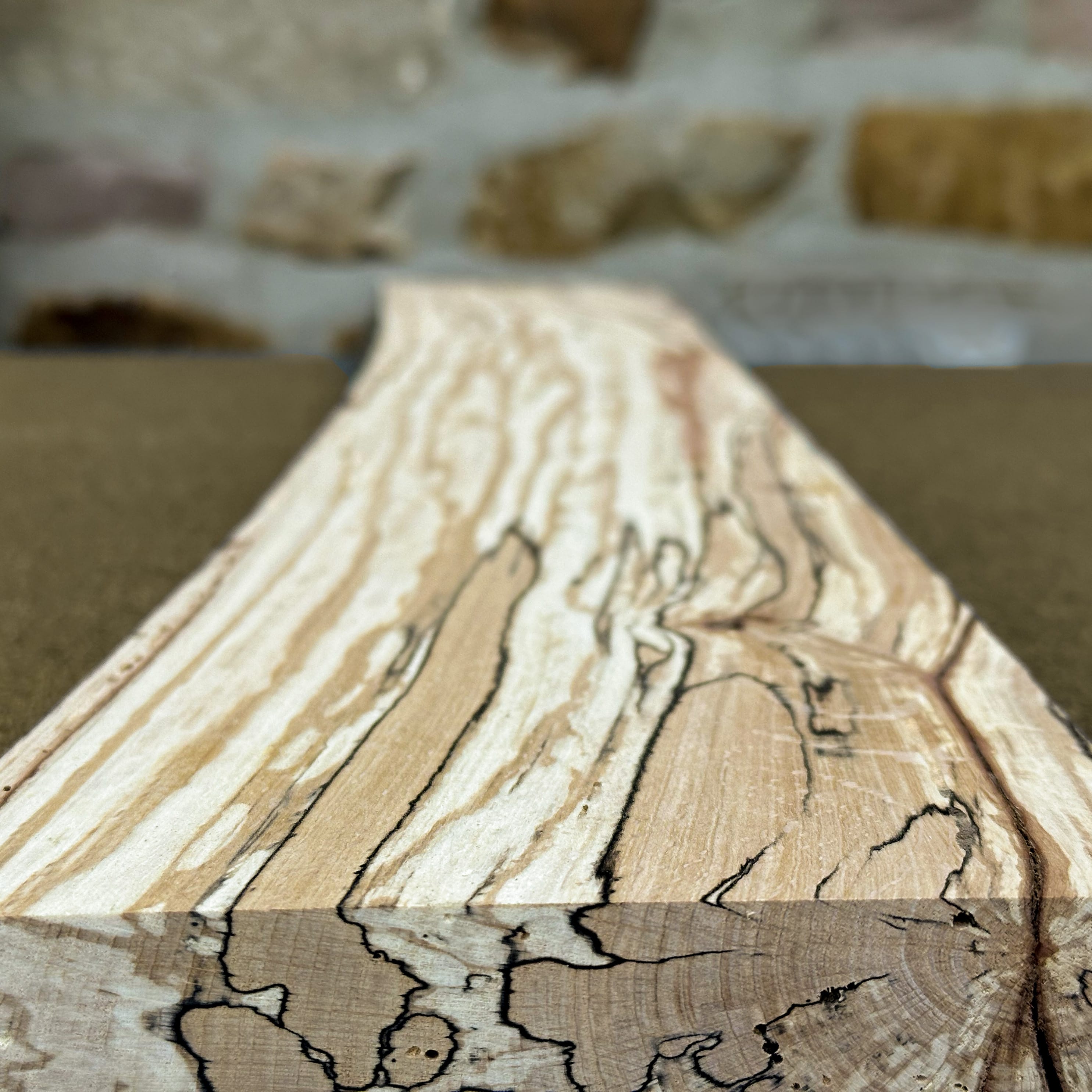 Spalted beech timber showing the dark marbled lines left by natural spalting