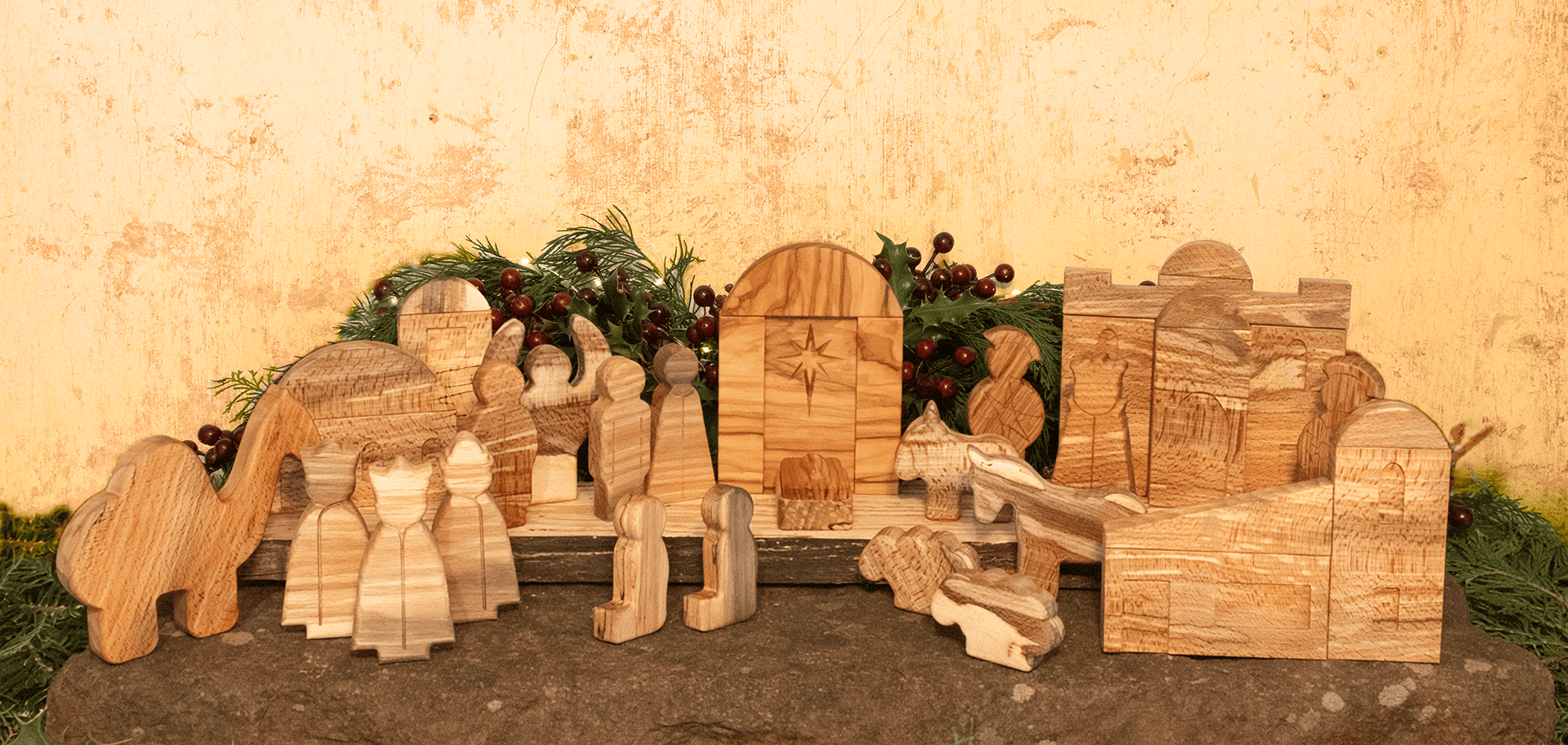Hand-carved wooden nativity set displayed on a mantelpiece